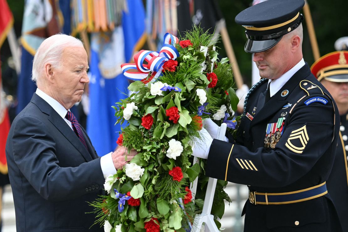 Biden participates in a wreath laying ceremony at the Tomb of the Unknown Soldier on Monday.